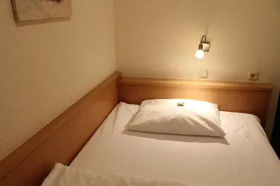 Ein Bett oder Betten in einem Zimmer der Unterkunft City Hotel Neuwied