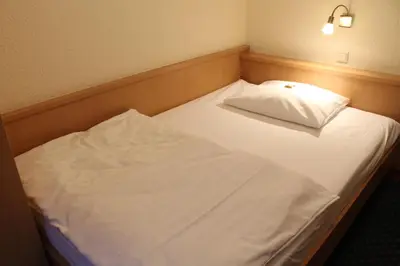 Ein Bett oder Betten in einem Zimmer der Unterkunft City Hotel Neuwied