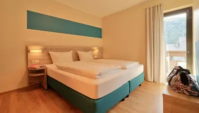 Ein Bett oder Betten in einem Zimmer der Unterkunft Gästehaus Lenartz-Beth