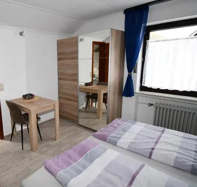 Ein Bett oder Betten in einem Zimmer der Unterkunft Gästehaus Steuer
