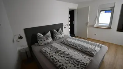 Ein Bett oder Betten in einem Zimmer der Unterkunft Gästehaus Steuer