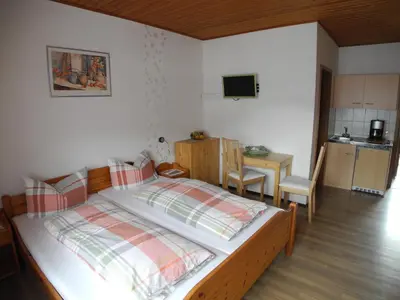 Ein Bett oder Betten in einem Zimmer der Unterkunft Gästehaus Steuer