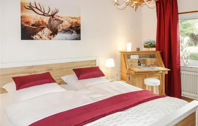 Ein Bett oder Betten in einem Zimmer der Unterkunft Awesome Home In Müllenbach With Kitchen