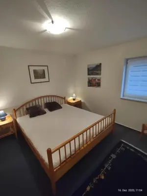 Ein Bett oder Betten in einem Zimmer der Unterkunft Ferienwohnung am Hofgarten
