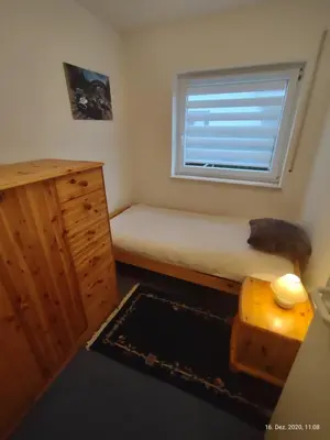 Ein Bett oder Betten in einem Zimmer der Unterkunft Ferienwohnung am Hofgarten
