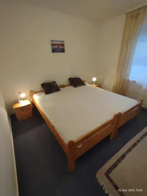 Ein Bett oder Betten in einem Zimmer der Unterkunft Ferienwohnung am Hofgarten