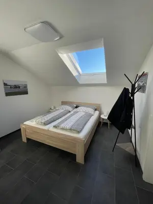 Ein Bett oder Betten in einem Zimmer der Unterkunft Gästehaus Veenstra