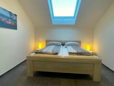 Ein Bett oder Betten in einem Zimmer der Unterkunft Gästehaus Veenstra