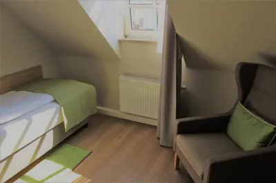 Ein Bett oder Betten in einem Zimmer der Unterkunft Hotel Eifelbräu