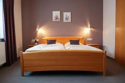 Ein Bett oder Betten in einem Zimmer der Unterkunft Gästehaus Kickert