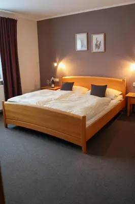 Ein Bett oder Betten in einem Zimmer der Unterkunft Gästehaus Kickert