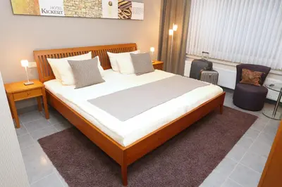 Ein Bett oder Betten in einem Zimmer der Unterkunft Gästehaus Kickert