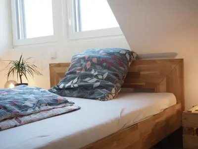 Ein Bett oder Betten in einem Zimmer der Unterkunft Gemütliche Wohnung im Zentrum, Kaffeevollautomat, Smart TV