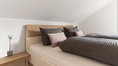 Ein Bett oder Betten in einem Zimmer der Unterkunft Gästehaus Simonis