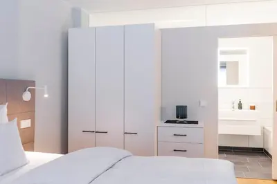 Ein Bett oder Betten in einem Zimmer der Unterkunft Apartments Trier