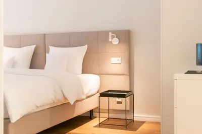 Ein Bett oder Betten in einem Zimmer der Unterkunft Apartments Trier