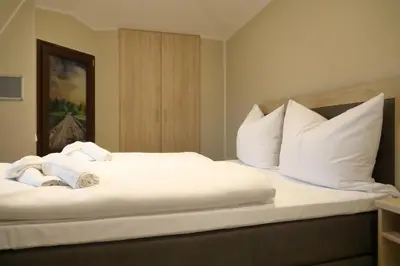 Ein Bett oder Betten in einem Zimmer der Unterkunft Pension Moselvilla 1900