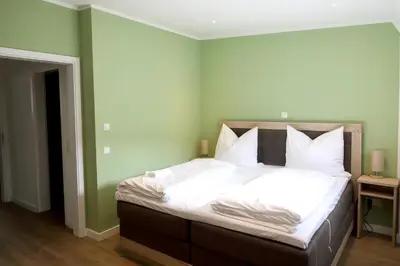 Ein Bett oder Betten in einem Zimmer der Unterkunft Pension Moselvilla 1900