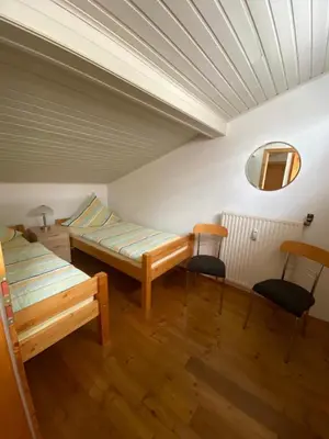 Ein Bett oder Betten in einem Zimmer der Unterkunft Ferienhaus Jüngling