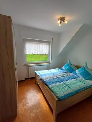 Ein Bett oder Betten in einem Zimmer der Unterkunft Ferienhaus Urban mit Garage
