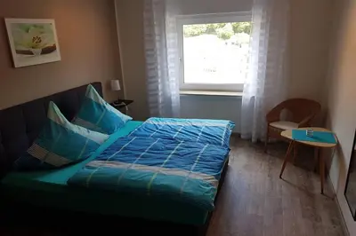 Ein Bett oder Betten in einem Zimmer der Unterkunft Ferienhaus Urban mit Garage