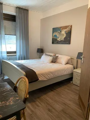 Ein Bett oder Betten in einem Zimmer der Unterkunft Parel aan de Moezel