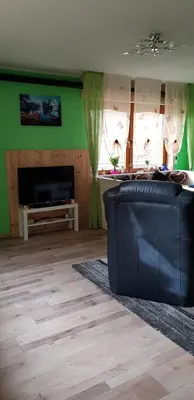 Ein Sitzbereich in der Unterkunft Pfötchen