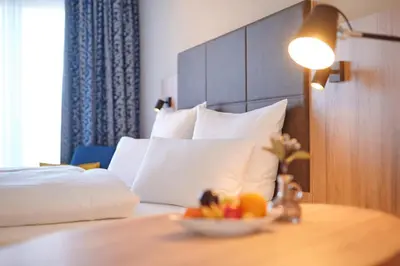 Ein Bett oder Betten in einem Zimmer der Unterkunft Kucher's Landhotel