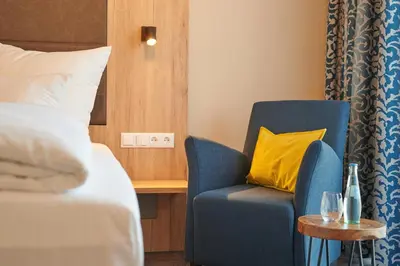 Ein Bett oder Betten in einem Zimmer der Unterkunft Kucher's Landhotel
