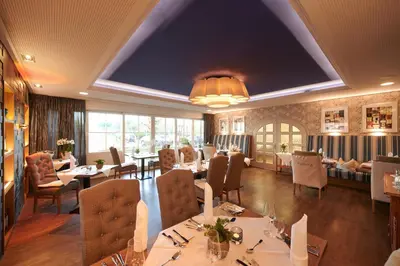 Ein Sitzbereich in der Unterkunft Kucher's Landhotel