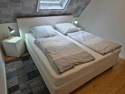 Ein Bett oder Betten in einem Zimmer der Unterkunft Ferienwohnung Rheinblick Bacharach am Rhein