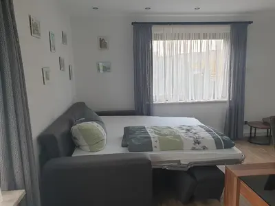 Ein Bett oder Betten in einem Zimmer der Unterkunft Ferienwohnung Rheinblick Bacharach am Rhein