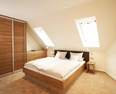 Ein Bett oder Betten in einem Zimmer der Unterkunft Hotel Am Helmwartsturm