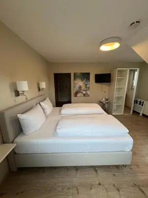 Ein Bett oder Betten in einem Zimmer der Unterkunft Hotel Heimatherz