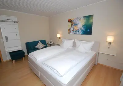 Ein Bett oder Betten in einem Zimmer der Unterkunft Hotel Heimatherz