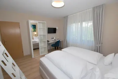 Ein Bett oder Betten in einem Zimmer der Unterkunft Hotel Heimatherz
