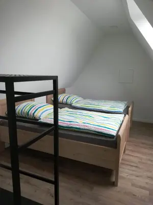 Ein Bett oder Betten in einem Zimmer der Unterkunft Präsenzhof Lay