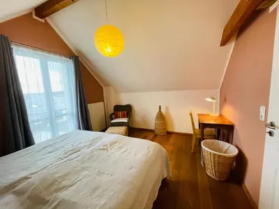 Ein Bett oder Betten in einem Zimmer der Unterkunft Ferienwohnung „Klein aber fein“