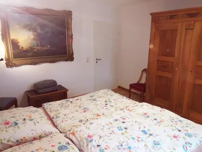 Ein Bett oder Betten in einem Zimmer der Unterkunft Ferienwohnung Am Michelsbach