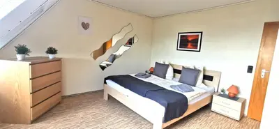 Ein Bett oder Betten in einem Zimmer der Unterkunft Ferienwohnung Landidylle Nassheck