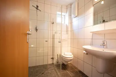 Ein Badezimmer in der Unterkunft Brauers Landarthotel GmbH