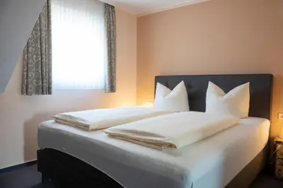 Ein Bett oder Betten in einem Zimmer der Unterkunft Mittelrhein Pension