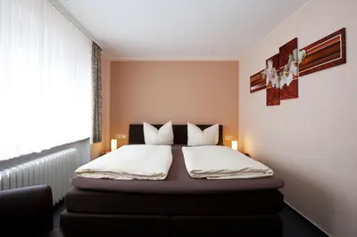Ein Bett oder Betten in einem Zimmer der Unterkunft Mittelrhein Pension