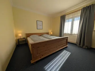 Ein Bett oder Betten in einem Zimmer der Unterkunft Hotel und Landgasthof Zum Bockshahn