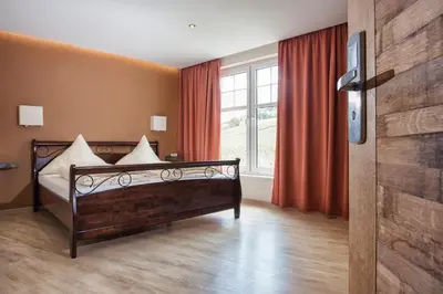 Ein Bett oder Betten in einem Zimmer der Unterkunft Hotel Filla Andre