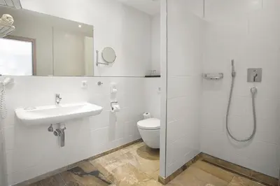 Ein Badezimmer in der Unterkunft Hotel Filla Andre
