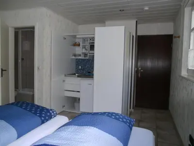 Ein Bett oder Betten in einem Zimmer der Unterkunft Pension & Apartments Linkemühle