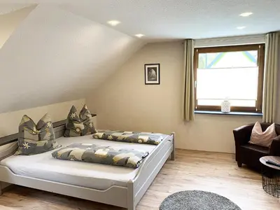 Ein Bett oder Betten in einem Zimmer der Unterkunft Ferienwohnungen Haus Gisela - Unterkunft Schlossberg