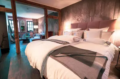 Ein Bett oder Betten in einem Zimmer der Unterkunft LÖFFELMÜHLE BOUTIQUE BED AND BREAKFAST