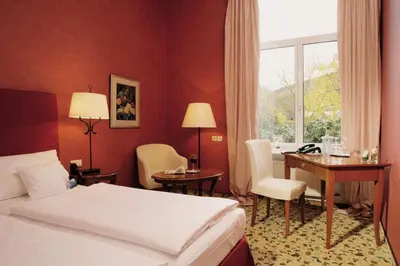 Ein Bett oder Betten in einem Zimmer der Unterkunft Hotel Villa Sanct Peter
